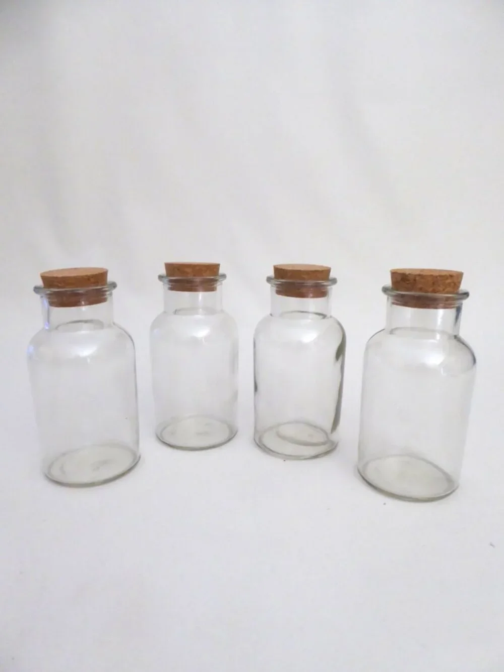 NEW 5” GLASS CORK TOPPED JARS KITCHEN CRAFT STORAGE JARS (LOT OF 4)